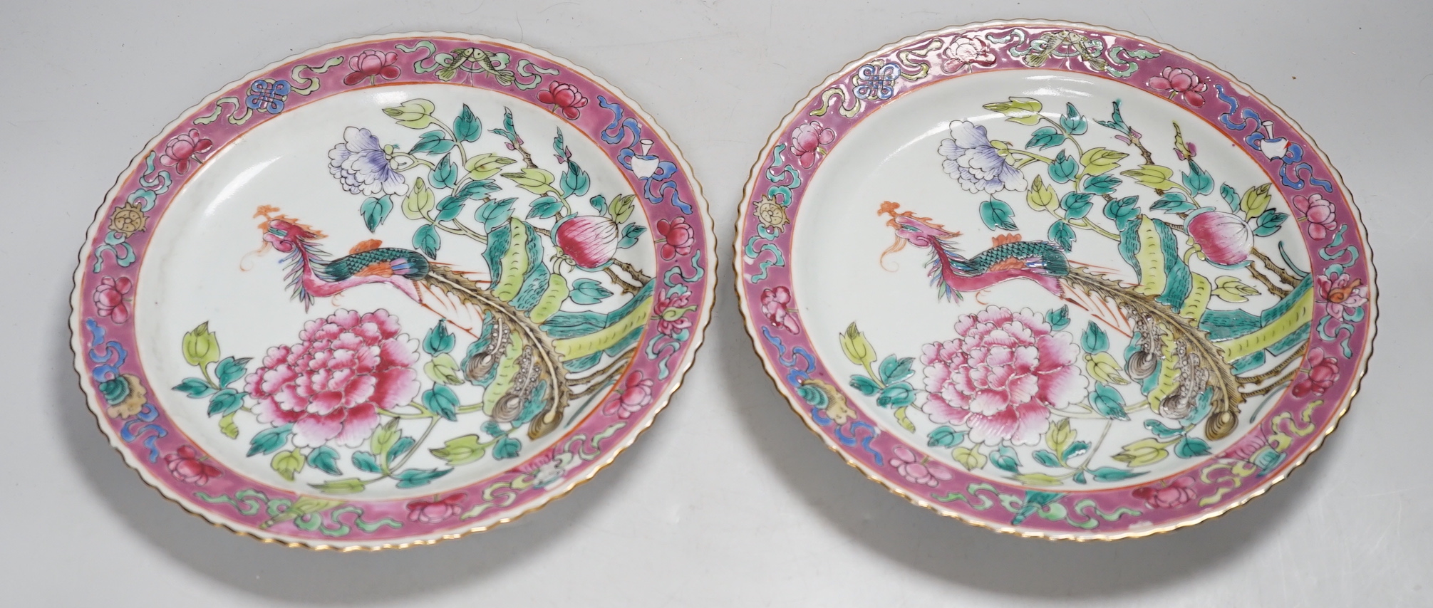 A pair of Chinese Straits famille rose plates for the Malaysian market, 23cm diameter